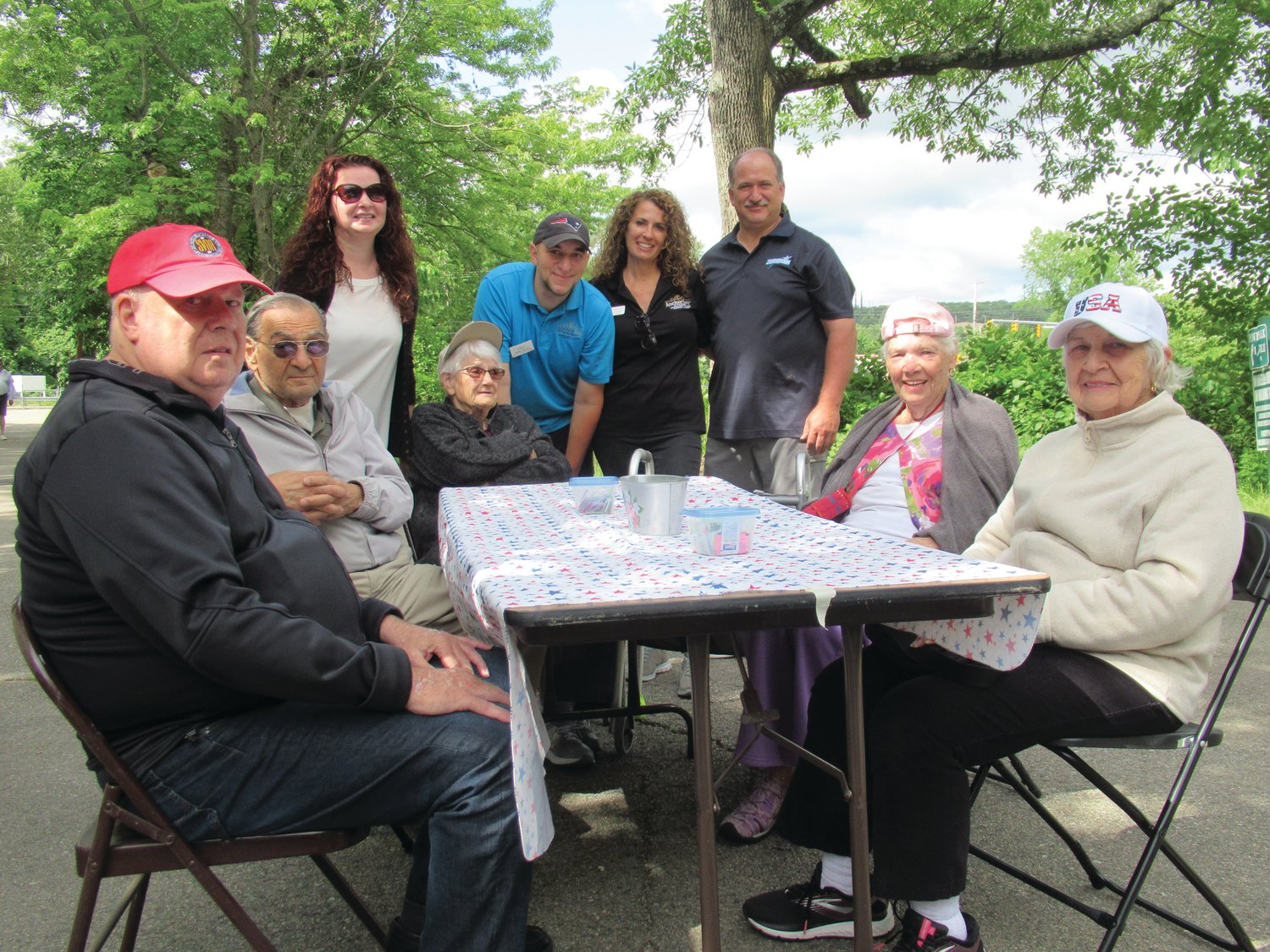 ANCHOR ANNEX: Anchor Bay at Pocasset staffers Gienevieve Ferucio, Laurie Spicuzza and Dan Marcello along with Johnston town Councilman Robert Civetti enjoy a break after serving coffee to residents Shirley, Anne, Paulione, Charlie and Chuck.